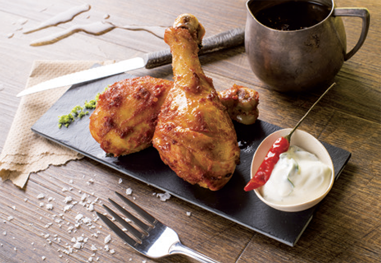 Chicken legs in a marinade of Dijon mustard and seasonings